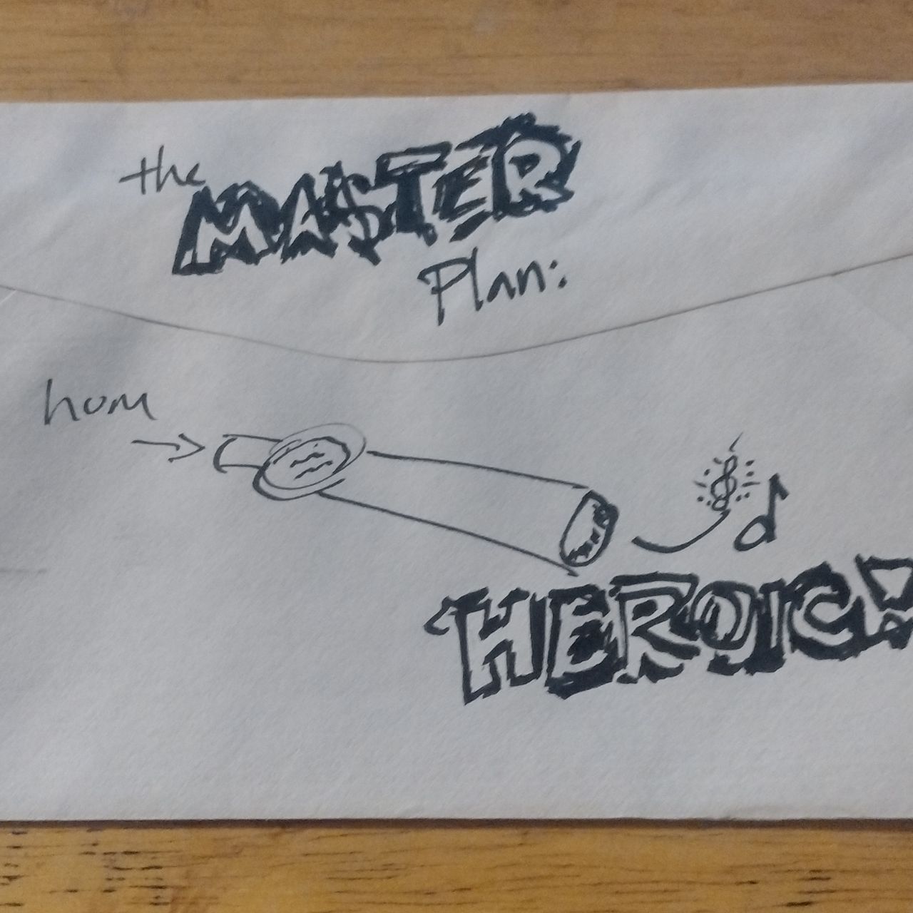 A rough sketch of a kazoo with operational instructions. Crude writing suggests madness at work.